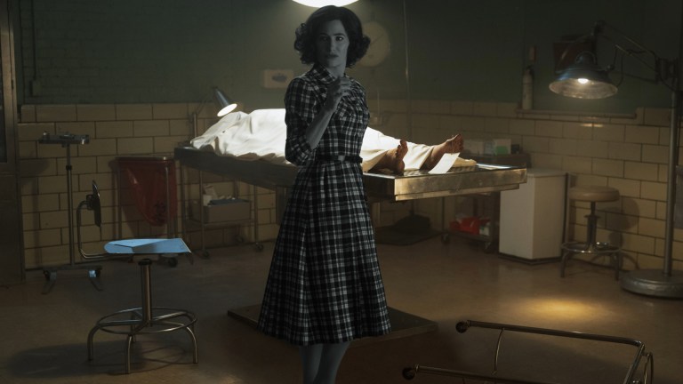 Detective Agnes O’Connor (Kathryn Hahn) stands in front of a body in Marvel Television's AGATHA ALL ALONG