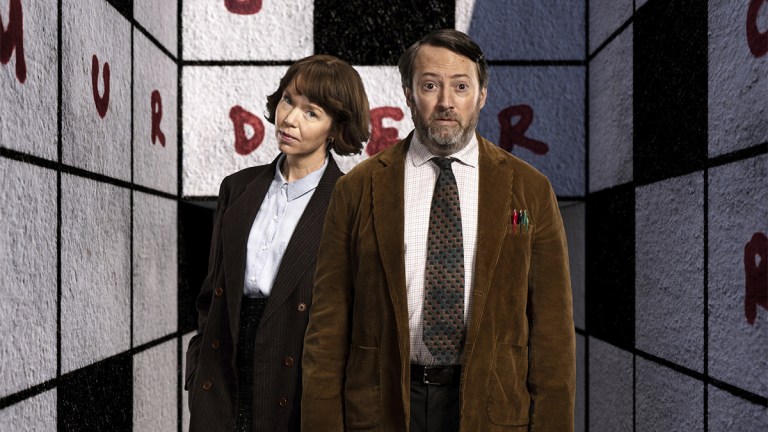 Anna Maxwell Martin and David Mitchell as Lucy and John in Ludwig against a backdrop of a giant crossword grid