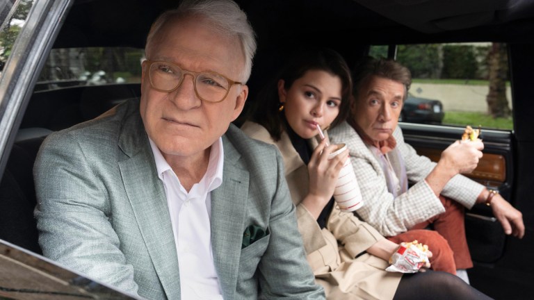 Charles-Haden Savage (Steve Martin), Mabel Mora (Selena Gomez), and Oliver Putnam (Martin Short) sit in the back of a limo eating In-N-Out in Only Murders in the Building season 4